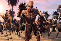 A horde of zombies lunge toward the camera.